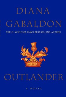 Book cover: Outlander. A blue cover with gold lettering and thistle emblem.